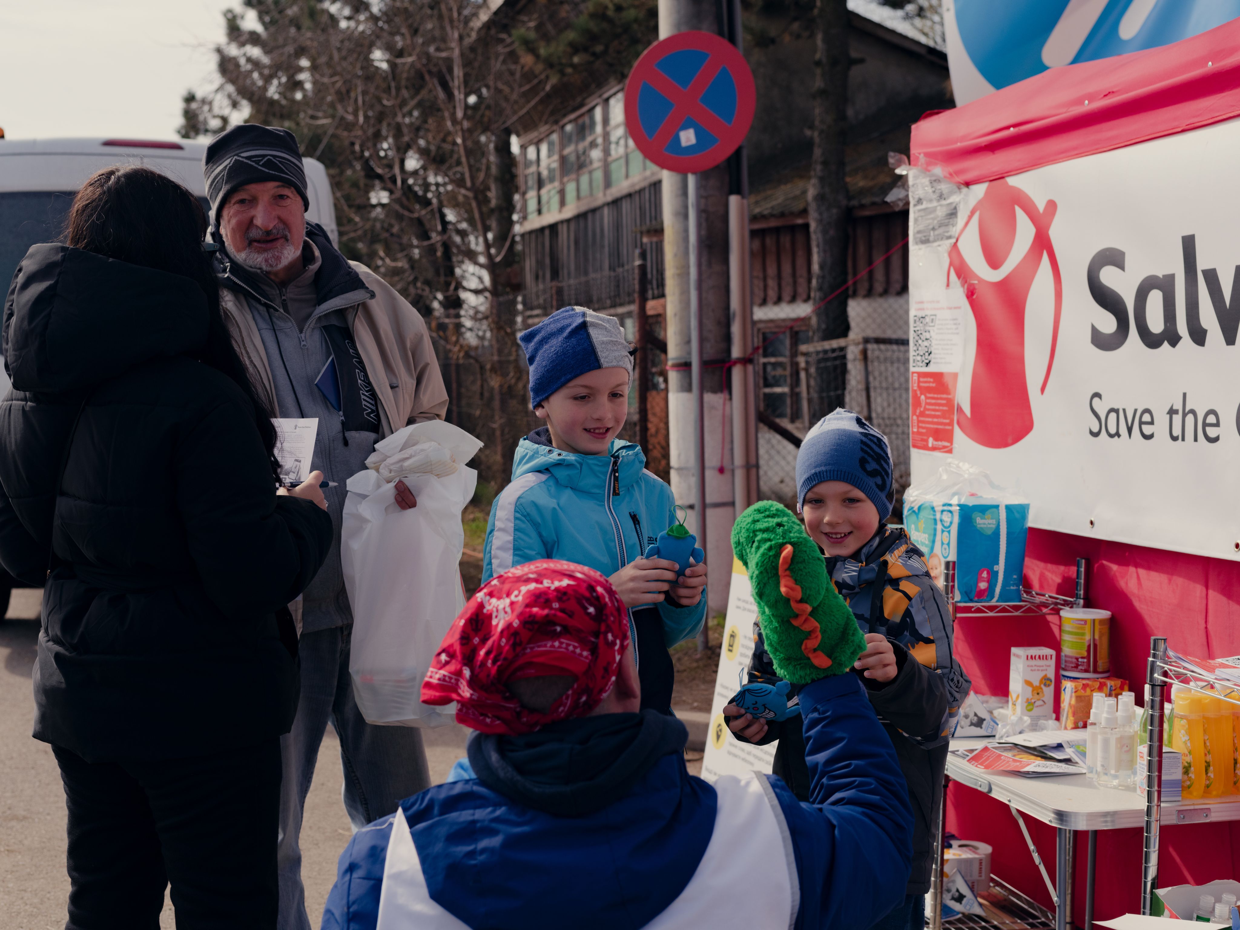 Children receive humanitarian assistance at the Romania border with Ukraine.