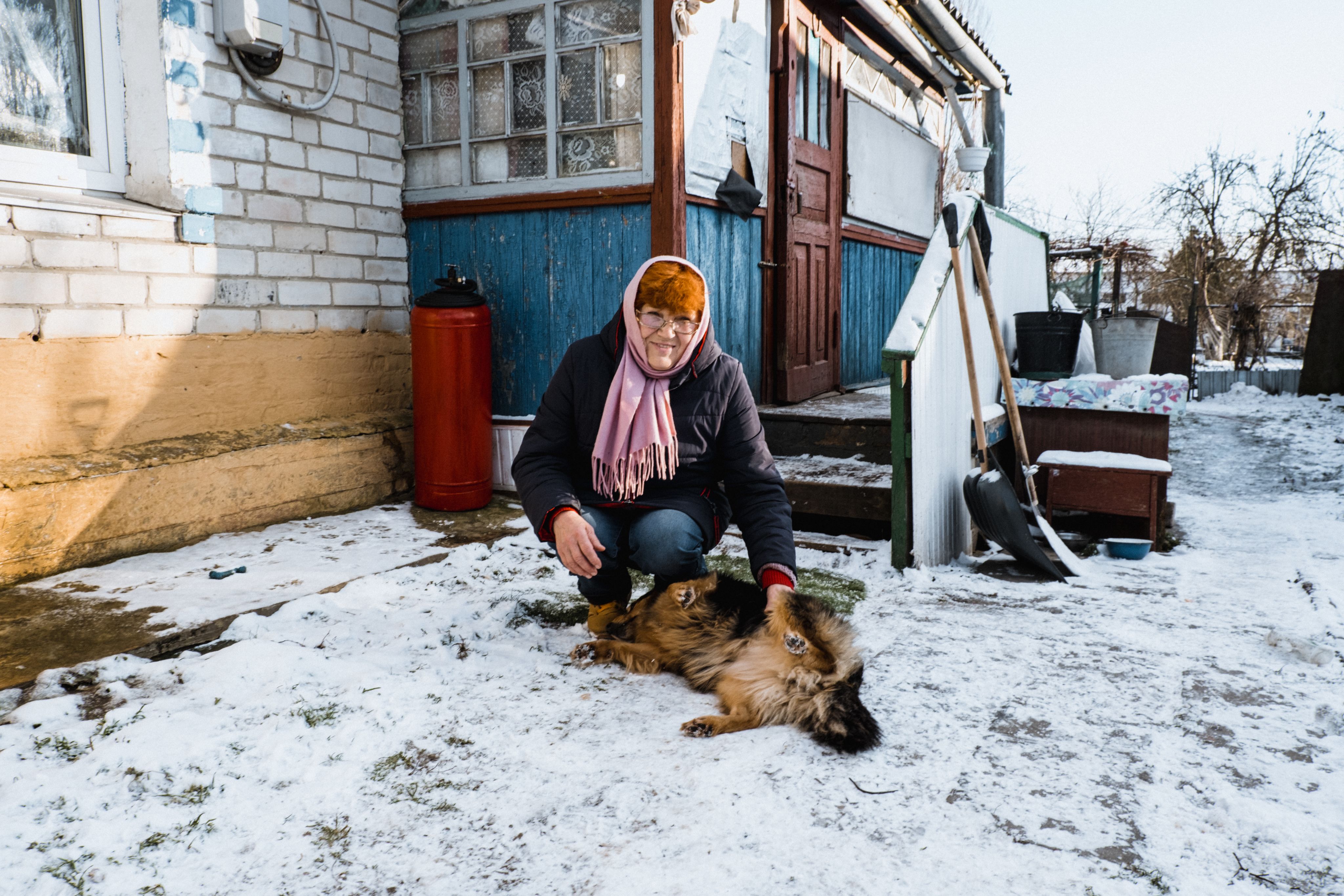 Polina's 68-year-old grandmother, Larysa, with her dog