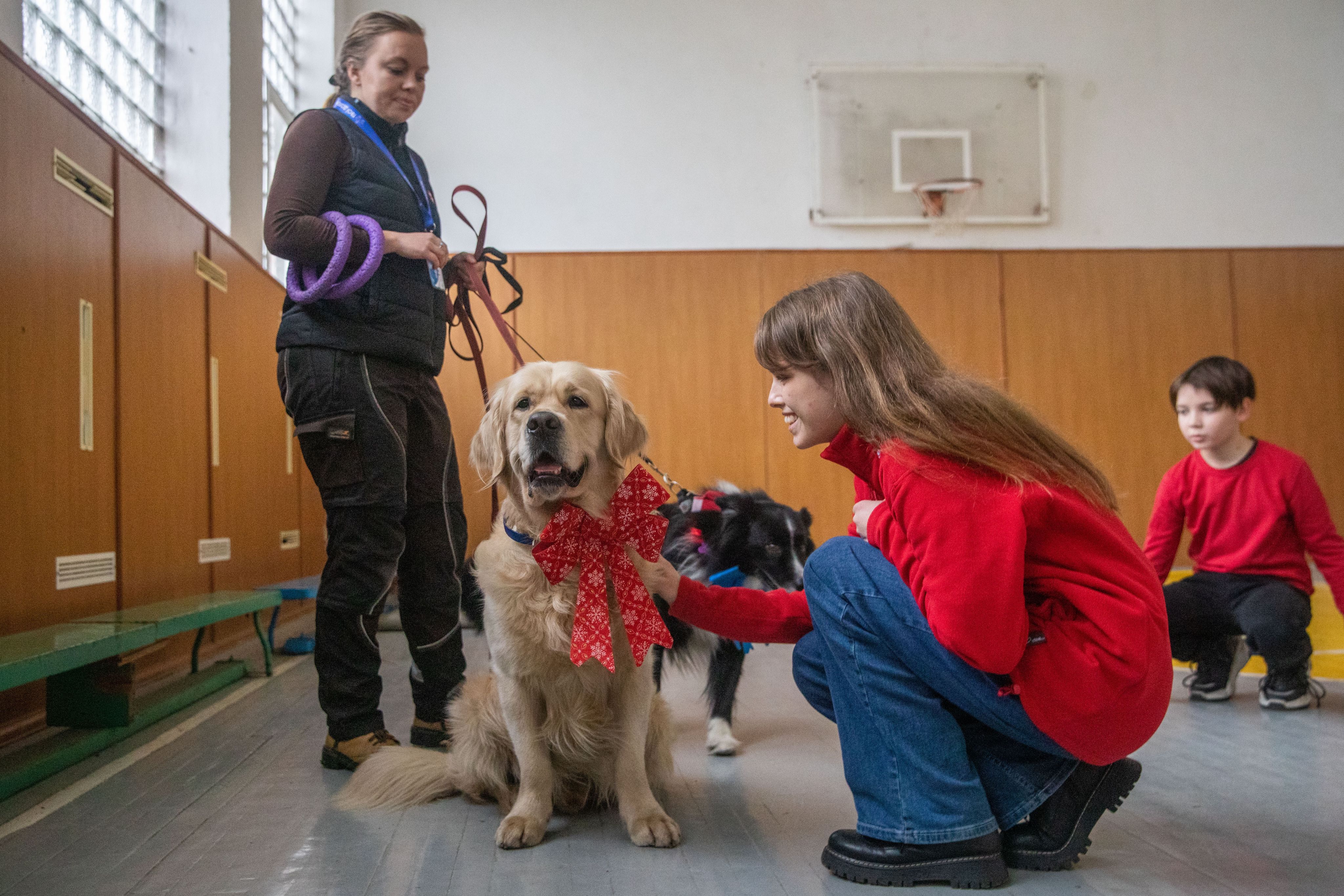 Kateryna photographed with therapy dog, Parker.